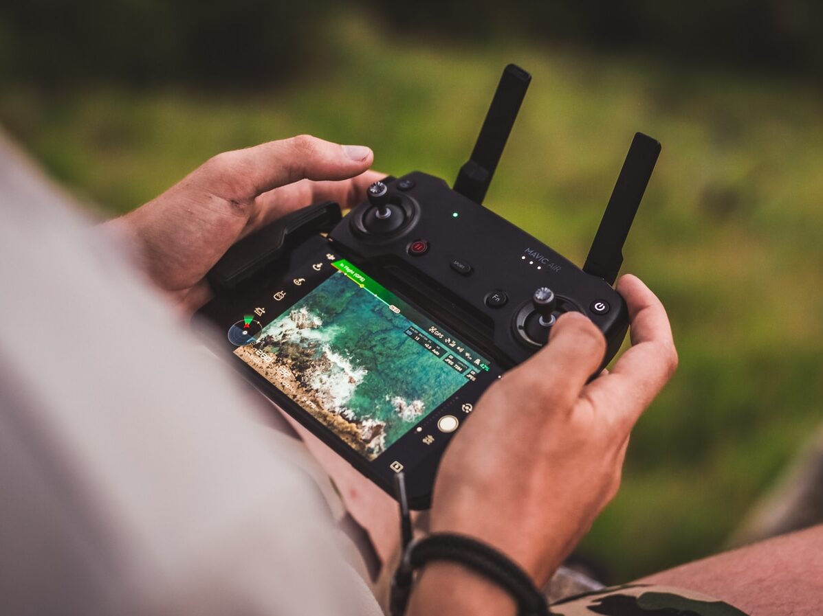 person playing game with joystick controller
