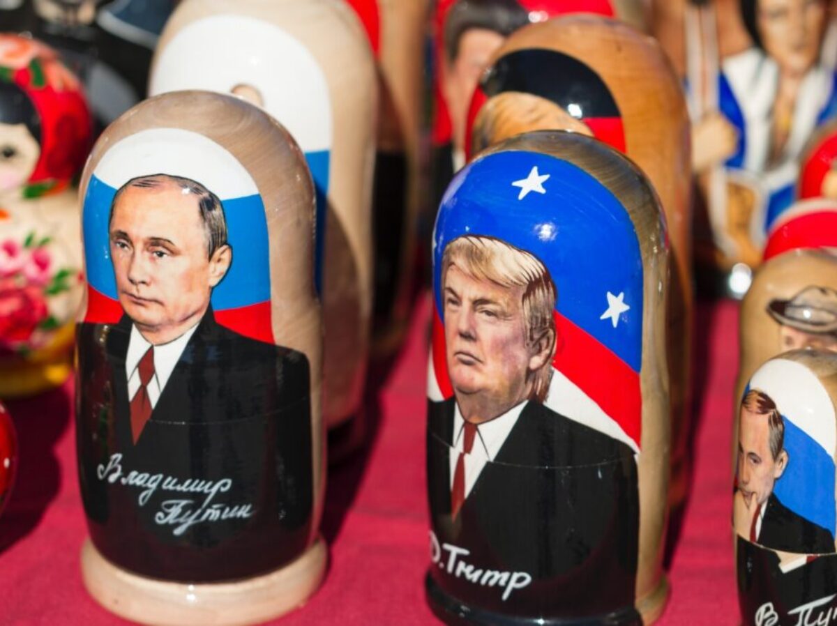 Donald Trump nesting dolls on red textile