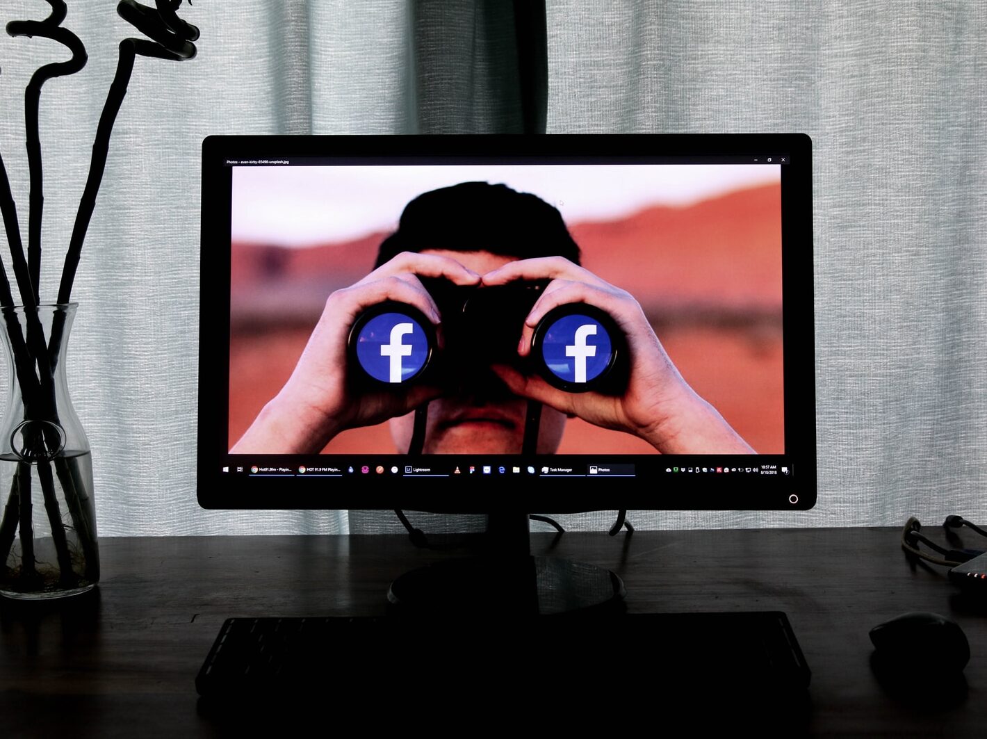 television showing man using binoculars