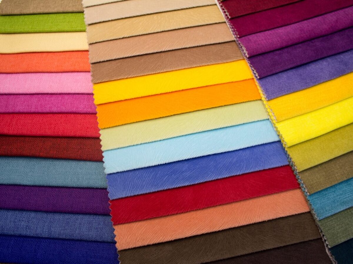 multi colored striped textile on brown wooden table