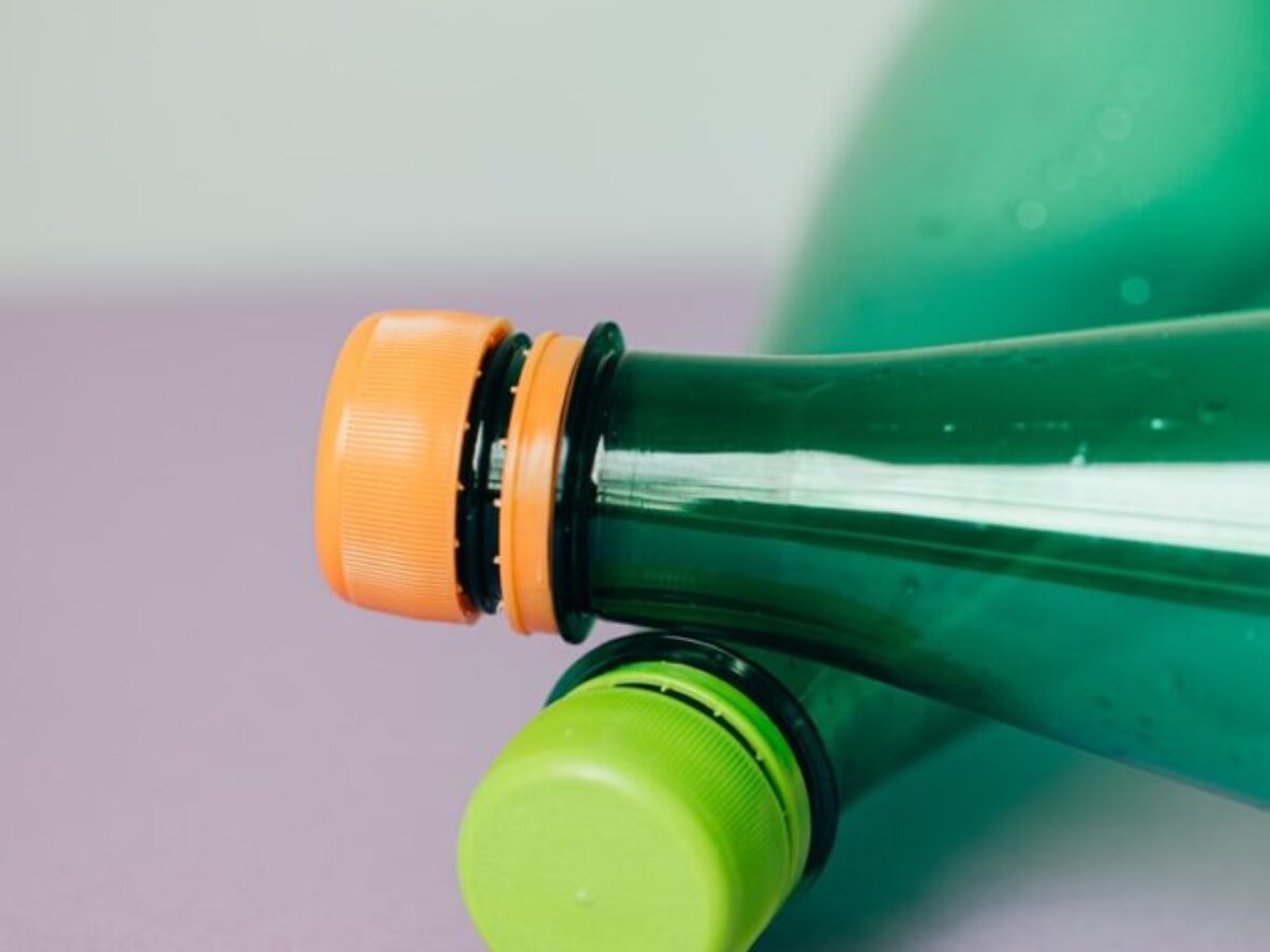 green bottle with yellow cap