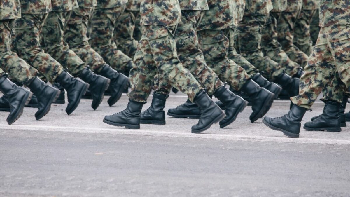 men in green and brown camouflage uniform