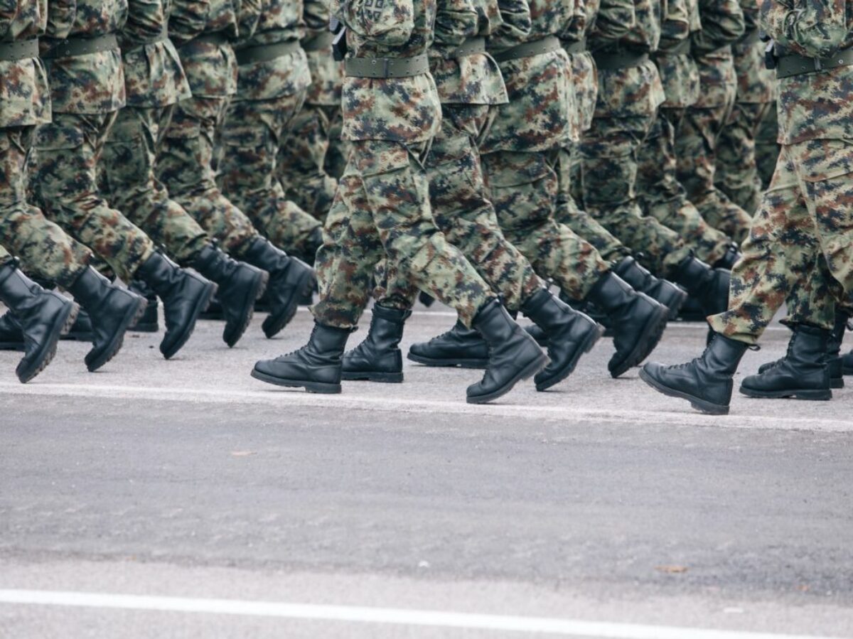 men in green and brown camouflage uniform