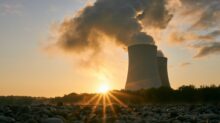 Low Angle Photo Of Nuclear Power Plant Buildings Emtting Smoke
