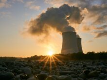 Low Angle Photo Of Nuclear Power Plant Buildings Emtting Smoke