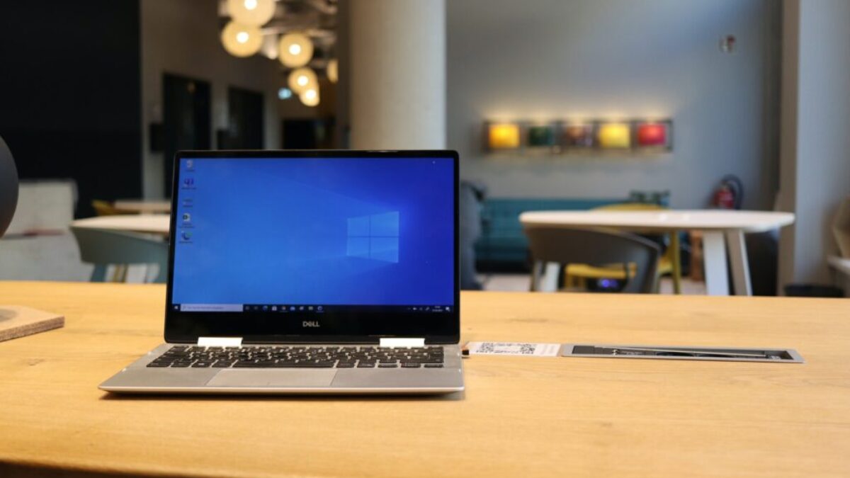 macbook pro on brown wooden table