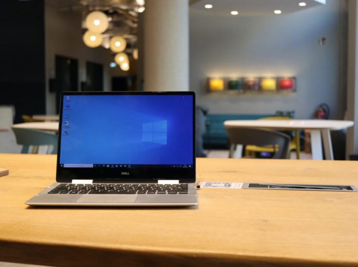 macbook pro on brown wooden table