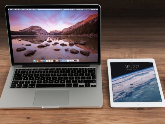Macbook Pro Beside White Ipad