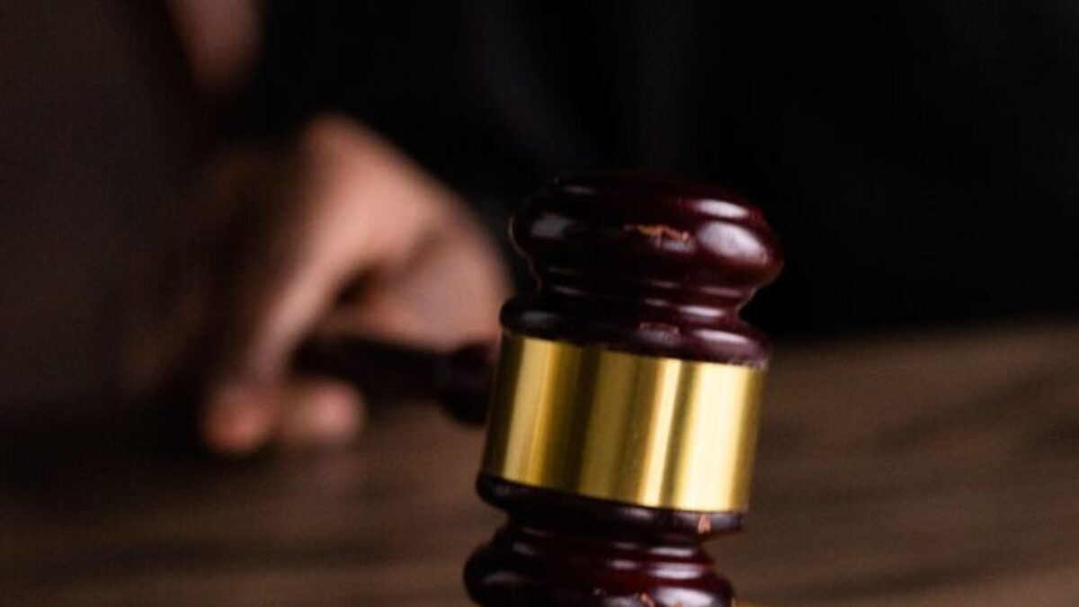 Brown and Gold Gavel on Brown Wooden Table