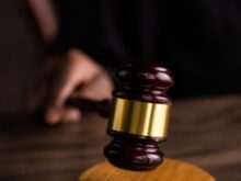 Brown and Gold Gavel on Brown Wooden Table