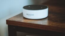 white and black round portable speaker