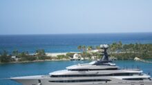 White and Blue Yacht on Body of Water