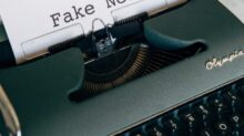 black and white typewriter on white table