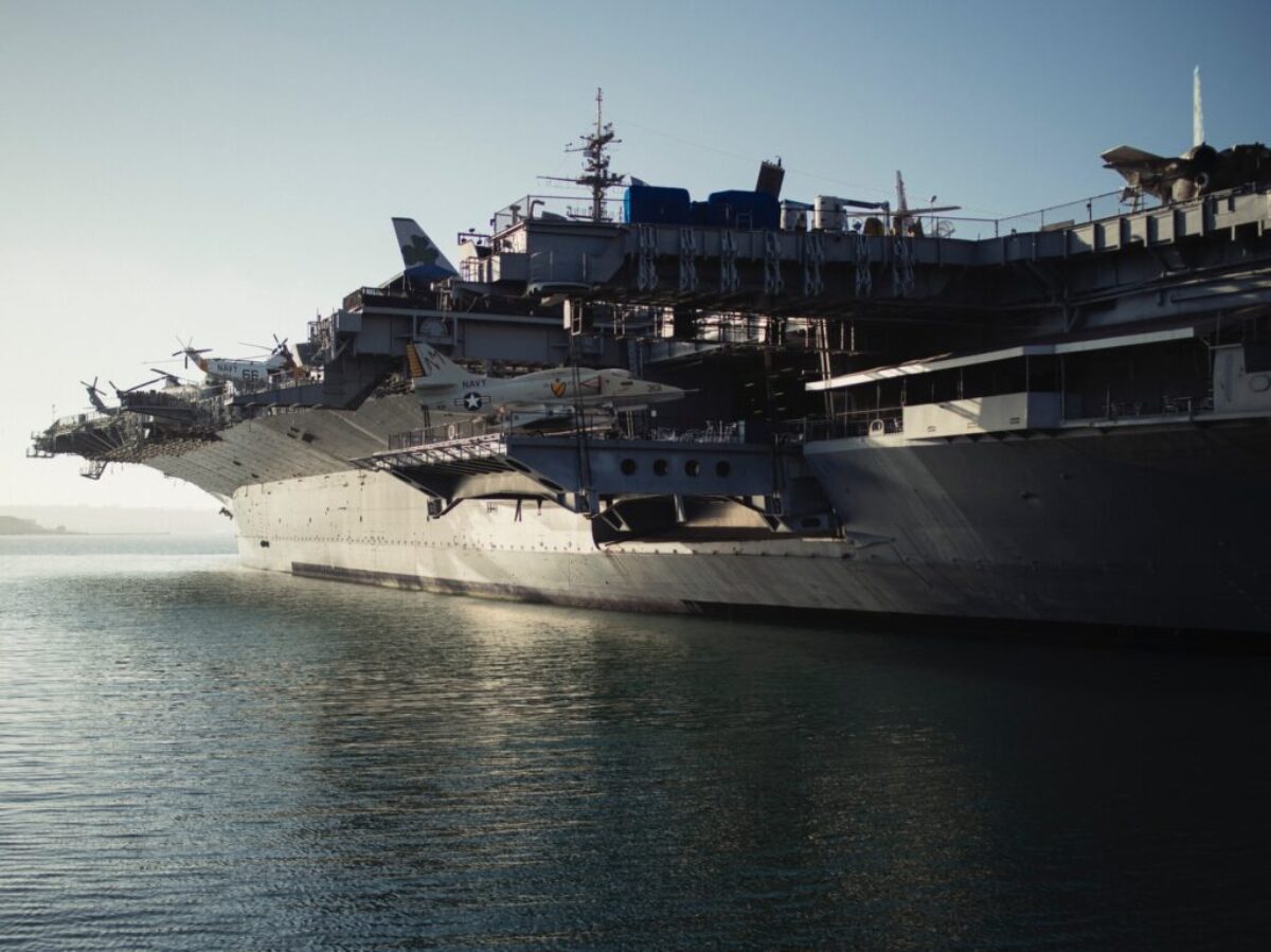 gray warship on body of water