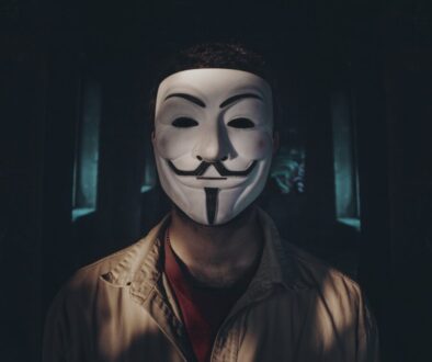person wearing guy fawkes mask