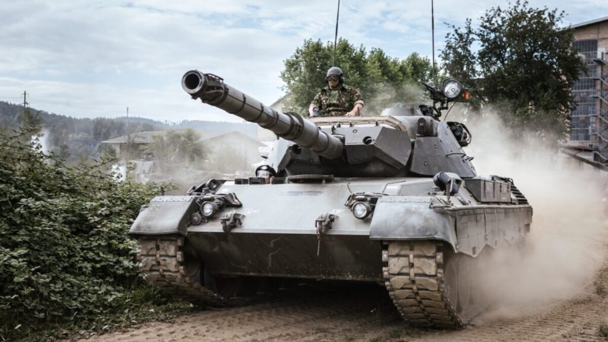 battle tank on green grass field during daytime