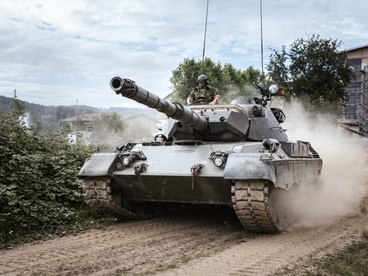 battle tank on green grass field during daytime