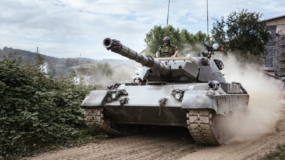 battle tank on green grass field during daytime