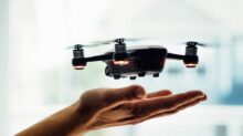 turned on black quadcopter drone