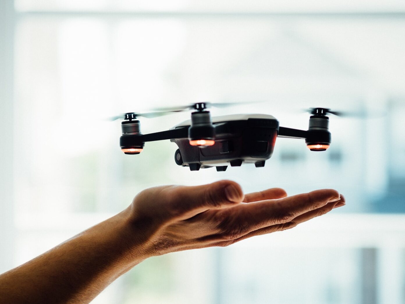 turned on black quadcopter drone