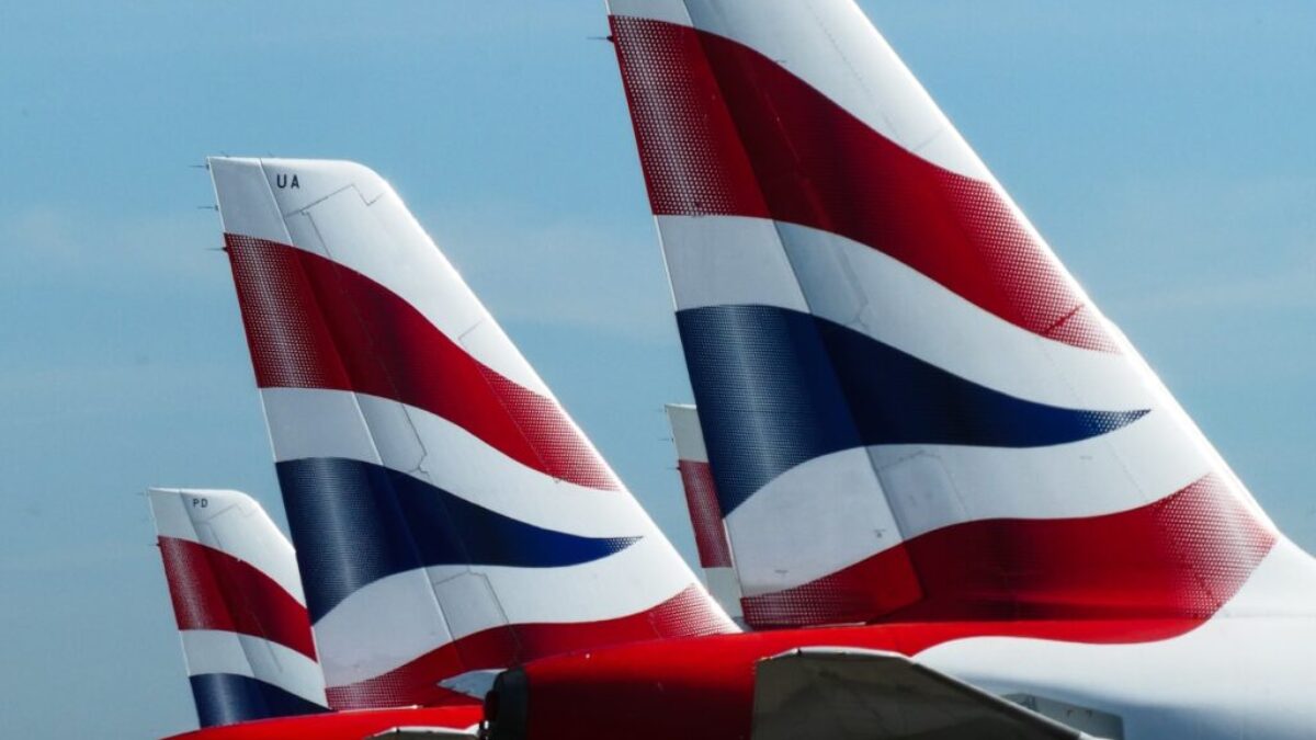 white and red plane on the sky