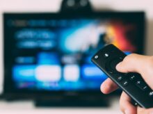 turned-on flat screen television