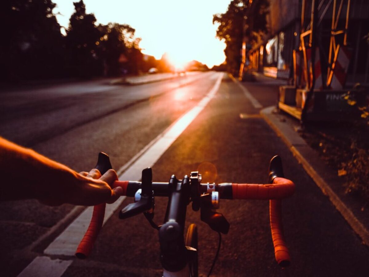 person riding on bicycle on road