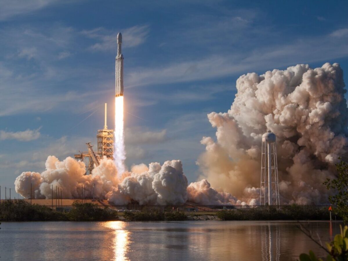 gray spacecraft taking off during daytime