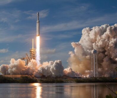 gray spacecraft taking off during daytime