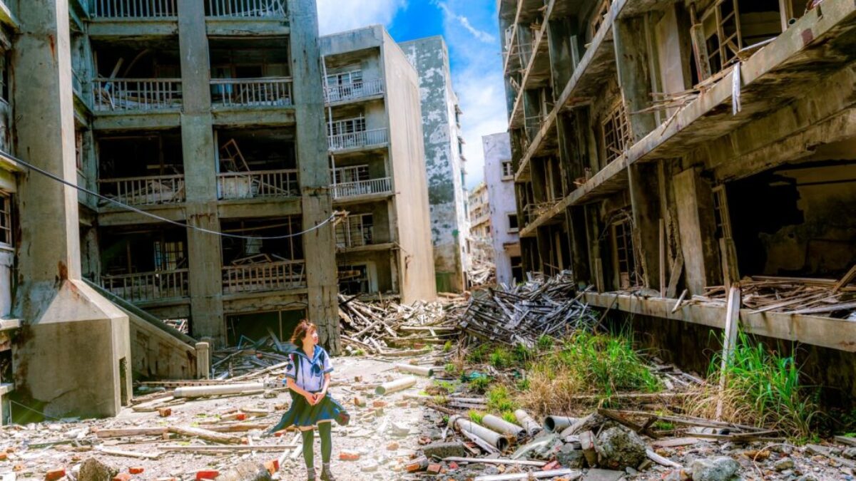 woman wearing white and green dress surrounded by storey buildings