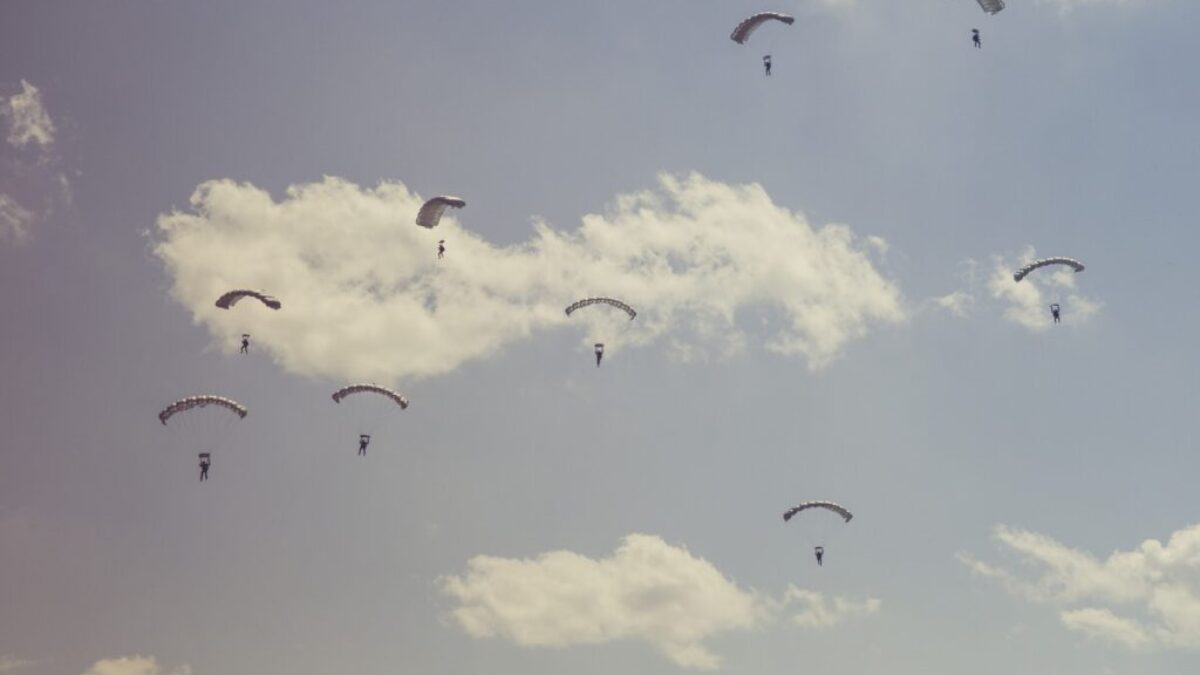 people on parachutes during daytime