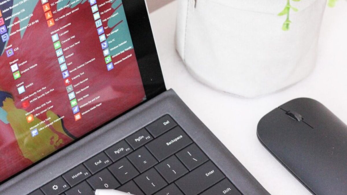 black laptop computer beside black wireless mouse