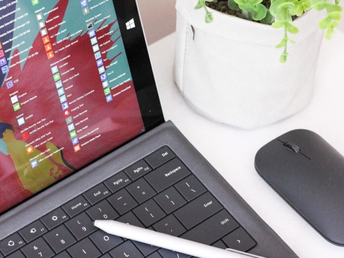 black laptop computer beside black wireless mouse