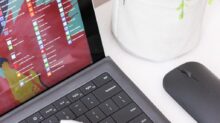 black laptop computer beside black wireless mouse