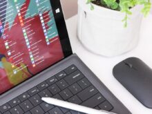 black laptop computer beside black wireless mouse