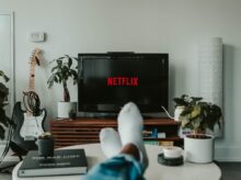black flat screen tv turned on displaying 11