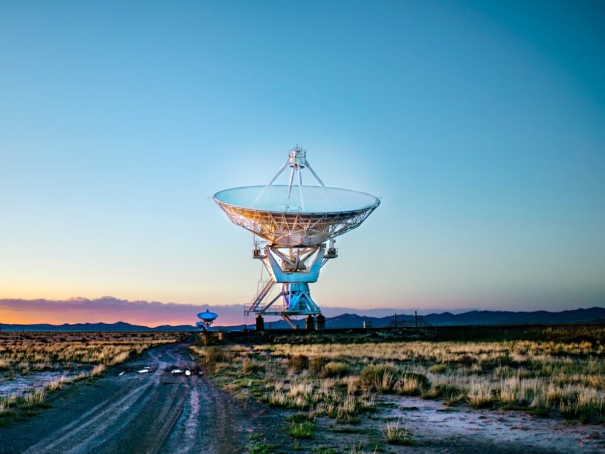 white radar telescope on grass field