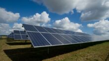 solar panels on green field