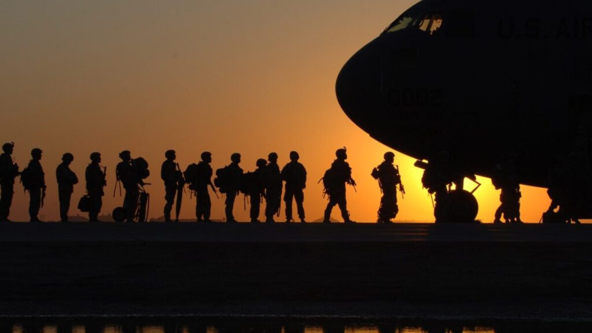 Soldiers in Line to Get in a Plane