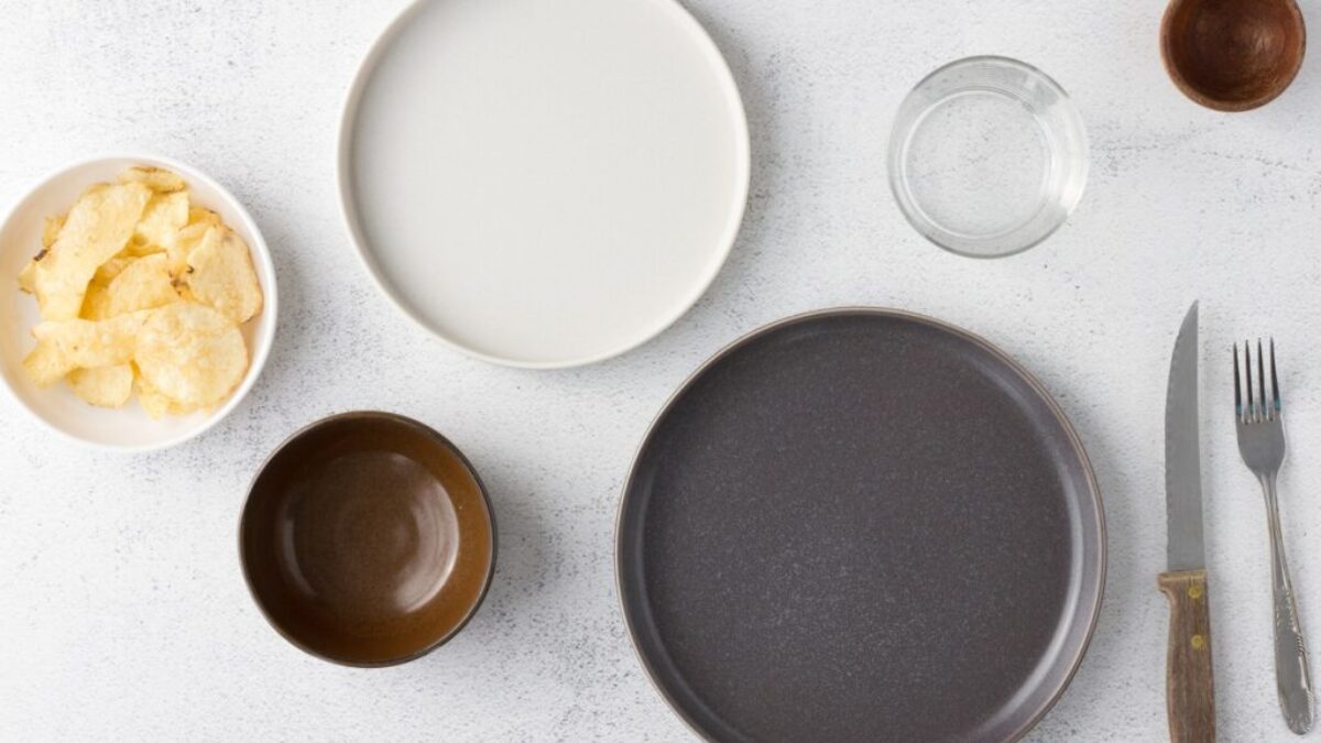 white ceramic round plate beside clear drinking glass