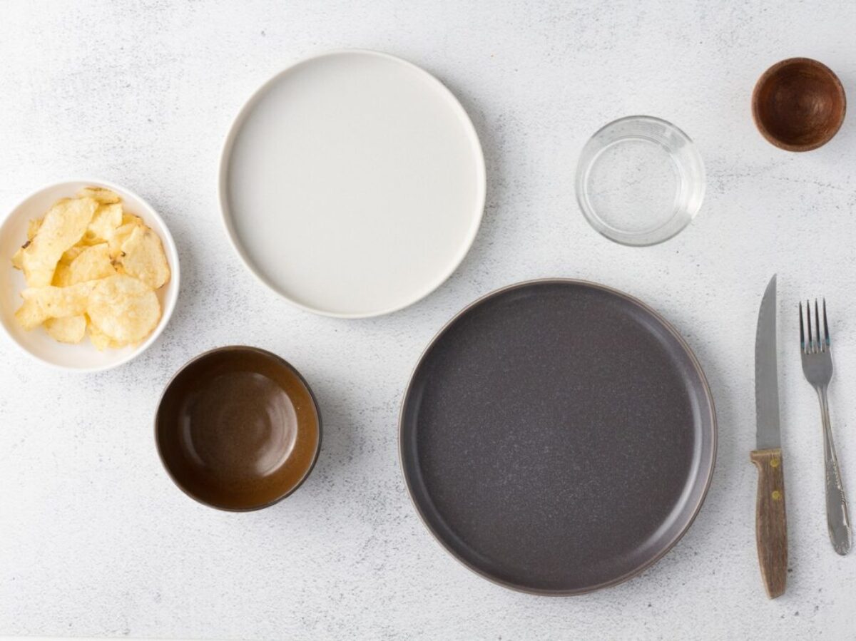 white ceramic round plate beside clear drinking glass