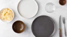 white ceramic round plate beside clear drinking glass