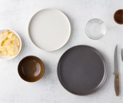 white ceramic round plate beside clear drinking glass