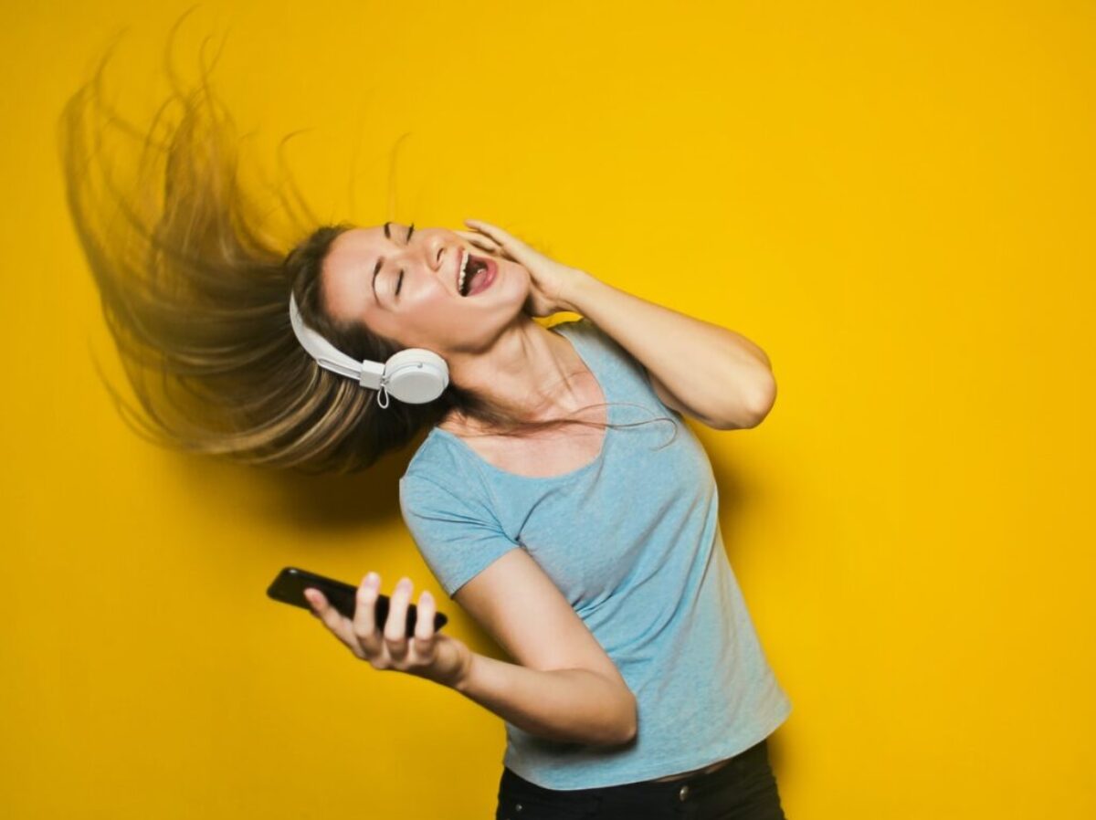 woman wearing white headphones