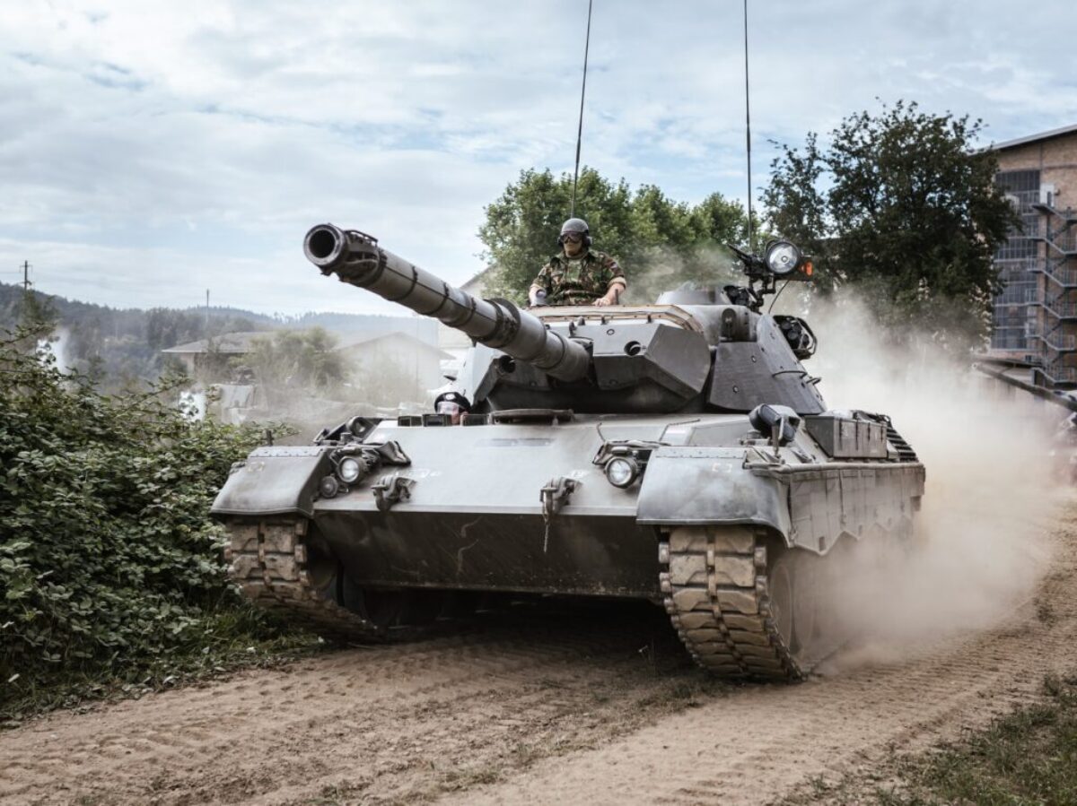 battle tank on green grass field during daytime