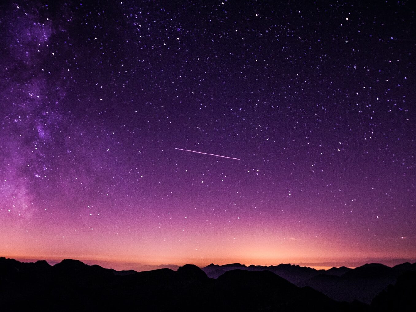 silhouette photo of mountain during night time