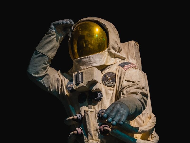 person in brown and black suit wearing brown helmet