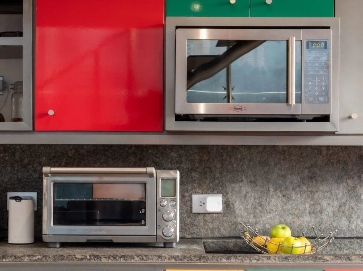 silver microwave oven on black marble counter top