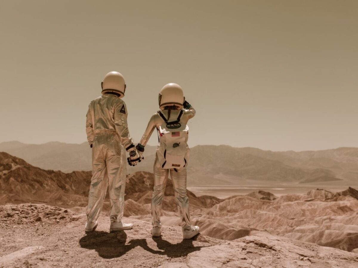 Back View of Astronauts Holding Hands