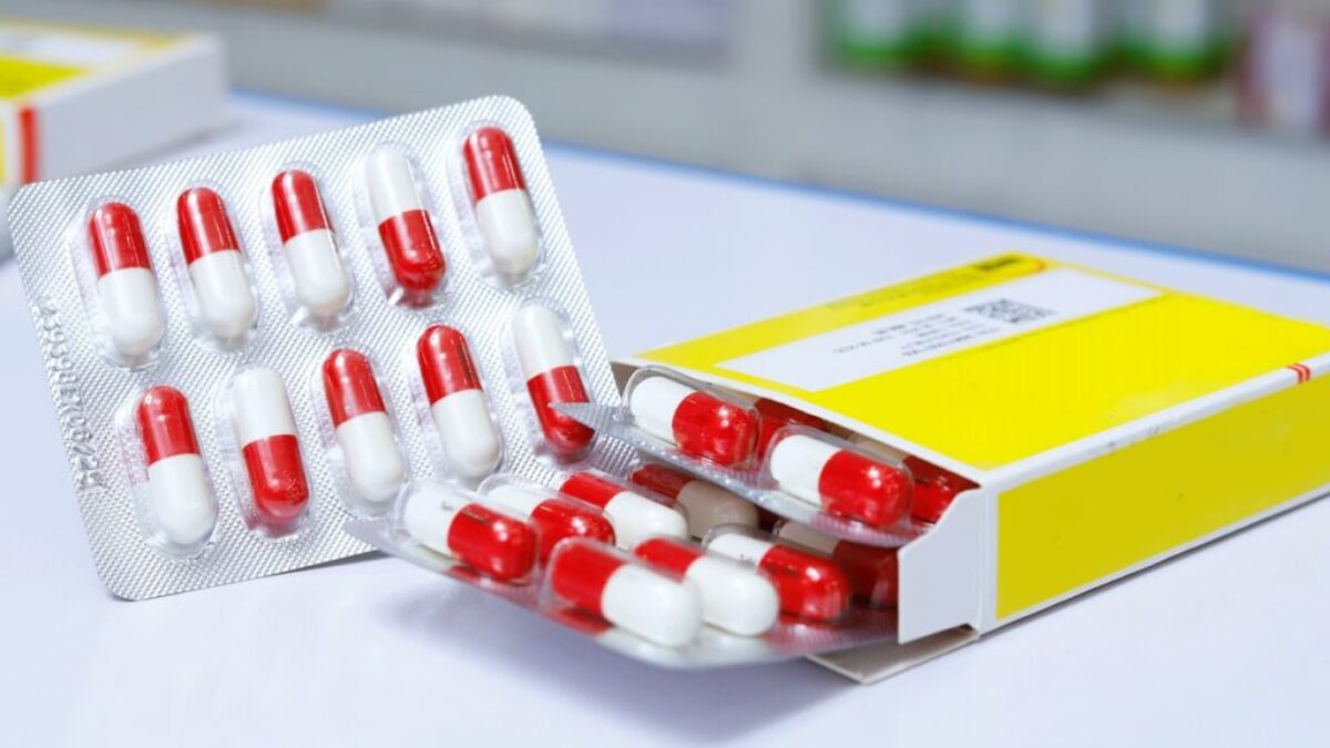 white and red medication pill blister pack